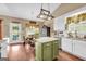 Spacious kitchen with an island, stainless steel appliances and a breakfast nook with lots of natural light at 4985 Rolling Rock Dr., Sugar Hill, GA 30518