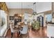 Charming kitchen with stylish lighting, island and eat-in kitchen dining at 4985 Rolling Rock Dr., Sugar Hill, GA 30518