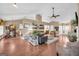 Spacious living area showcasing open floor plan connecting dining and living spaces at 4985 Rolling Rock Dr., Sugar Hill, GA 30518