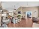 Bright, open living room with hardwood floors and multiple seating areas at 4985 Rolling Rock Dr., Sugar Hill, GA 30518