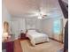 This bedroom features a neutral palette, a comfortable bed, and a ceiling fan at 75 Grady Smith St, Grantville, GA 30220