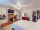 The bedroom boasts a cozy fireplace, dresser, closet, and an abundance of natural light at 75 Grady Smith St, Grantville, GA 30220