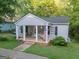Charming home featuring a covered porch and well-maintained lawn at 75 Grady Smith St, Grantville, GA 30220