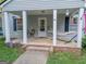 Charming front porch featuring a hammock, seating, and curb appeal at 75 Grady Smith St, Grantville, GA 30220