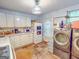 Functional kitchen with appliances and laundry area at 75 Grady Smith St, Grantville, GA 30220
