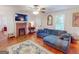 Inviting living room boasts a brick fireplace and comfortable seating at 75 Grady Smith St, Grantville, GA 30220