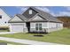 Well-maintained single-story home with a two-car garage and freshly installed lawn at 481 Cantrell Drive, Dallas, GA 30157