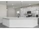 Modern kitchen with a large island, stainless steel appliances, and white cabinets at 481 Cantrell Drive, Dallas, GA 30157