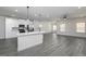 Open-concept kitchen and living area with a large island, modern appliances, and ample natural light at 481 Cantrell Drive, Dallas, GA 30157