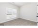 Well-lit bedroom features neutral walls, plush carpet and a window for natural light at 539 Cantrell Drive, Dallas, GA 30157