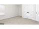 Bedroom with plush carpet flooring and a pair of closet doors at 539 Cantrell Drive, Dallas, GA 30157