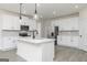 Gourmet kitchen features a large center island, stainless steel appliances, and ample storage space at 539 Cantrell Drive, Dallas, GA 30157