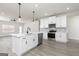 Modern kitchen with stainless steel appliances, white cabinets, and a center island at 539 Cantrell Drive, Dallas, GA 30157