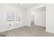 Open-concept living room with modern flooring, neutral paint, and natural light at 539 Cantrell Drive, Dallas, GA 30157
