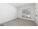 Bright bedroom featuring soft carpet and a large window at 601 Cantrell Drive, Dallas, GA 30157