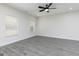 Spacious bedroom with wood-look floors, white trim, and two windows providing ample natural light at 601 Cantrell Drive, Dallas, GA 30157