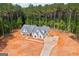 An aerial view of the new home and concrete driveway surrounded by trees at 4751 H D Atha Rd, Covington, GA 30014