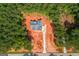 An aerial shot showing the location of the home within a heavily wooded area at 4751 H D Atha Rd, Covington, GA 30014