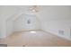 Attic bedroom with natural light from a single window and a ceiling fan at 4751 H D Atha Rd, Covington, GA 30014