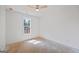 Simple bedroom with a ceiling fan and a large window offering abundant natural light at 4751 H D Atha Rd, Covington, GA 30014