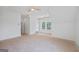 Spacious attic bedroom with a ceiling fan, a double window, and closet at 4751 H D Atha Rd, Covington, GA 30014