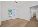 Dining room with hardwood floors, chandelier, and natural light from a large window at 4751 H D Atha Rd, Covington, GA 30014