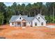 Beautiful new construction home with a white exterior, gray roof and lots of curb appeal at 4751 H D Atha Rd, Covington, GA 30014