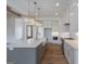 Elegant kitchen with white cabinets, stainless steel appliances, and a kitchen island at 4751 H D Atha Rd, Covington, GA 30014