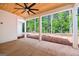 An outdoor covered patio with a ceiling fan and columns at 4751 H D Atha Rd, Covington, GA 30014