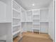 Spacious walk-in closet with custom built-in shelving and storage, offering ample space for organization at 4751 H D Atha Rd, Covington, GA 30014