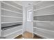 Bright walk-in closet featuring built-in shelving, storage space and natural light at 4751 H D Atha Rd, Covington, GA 30014