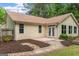Backyard view of the home featuring a patio and garden at 205 N Strathmore Dr, Sharpsburg, GA 30277
