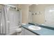 Bright bathroom with vanity, sink, mirror, shower and tub combination at 205 N Strathmore Dr, Sharpsburg, GA 30277