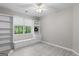 Bedroom with built-in shelving and window bench providing storage and natural light at 205 N Strathmore Dr, Sharpsburg, GA 30277