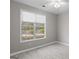 Bedroom featuring modern color palette and lots of natural light from a large window at 205 N Strathmore Dr, Sharpsburg, GA 30277