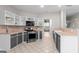 Kitchen with stainless steel appliances and views into the living area at 205 N Strathmore Dr, Sharpsburg, GA 30277
