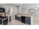 Spacious kitchen with stainless steel appliances and ample counter space, perfect for cooking and entertaining at 205 N Strathmore Dr, Sharpsburg, GA 30277