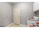 Functional laundry room with a door to the backyard, washer, and dryer at 205 N Strathmore Dr, Sharpsburg, GA 30277