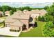 Aerial view of brick home featuring a covered patio and well-maintained lawn at 2589 Lake Erma Dr, Hampton, GA 30228