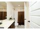 Cozy bathroom with a vanity, shower and tub combination, and decorative shower curtain at 2589 Lake Erma Dr, Hampton, GA 30228