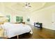 Large bedroom with hardwood floors, tray ceiling, and lots of natural light at 2589 Lake Erma Dr, Hampton, GA 30228
