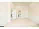 Bright, spacious bedroom with high ceiling and access to a bathroom and hallway at 2589 Lake Erma Dr, Hampton, GA 30228