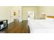 Bright bedroom with hardwood floors and multiple entry ways into other rooms at 2589 Lake Erma Dr, Hampton, GA 30228