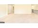 Bonus room with carpet flooring, lots of natural light, and hallways leading to other rooms at 2589 Lake Erma Dr, Hampton, GA 30228
