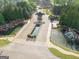 Elegant community entrance with stone gate, water features, and lush landscaping provides a grand welcome at 2589 Lake Erma Dr, Hampton, GA 30228