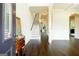 Bright foyer with hardwood floors, staircase, and elegant trim, creating a welcoming entrance at 2589 Lake Erma Dr, Hampton, GA 30228