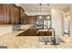Gourmet kitchen with granite countertops, stainless steel appliances, and dark wood cabinetry at 2589 Lake Erma Dr, Hampton, GA 30228