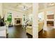 Bright, open living room with fireplace, coffered ceilings, hardwood floors and neutral walls at 2589 Lake Erma Dr, Hampton, GA 30228