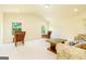 Spacious living room featuring large windows with views of the yard, and comfortable seating at 2589 Lake Erma Dr, Hampton, GA 30228