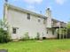 Back exterior view of a two-story house with a deck, a door to the basement and a grassy yard at 140 Joshua St, Palmetto, GA 30268